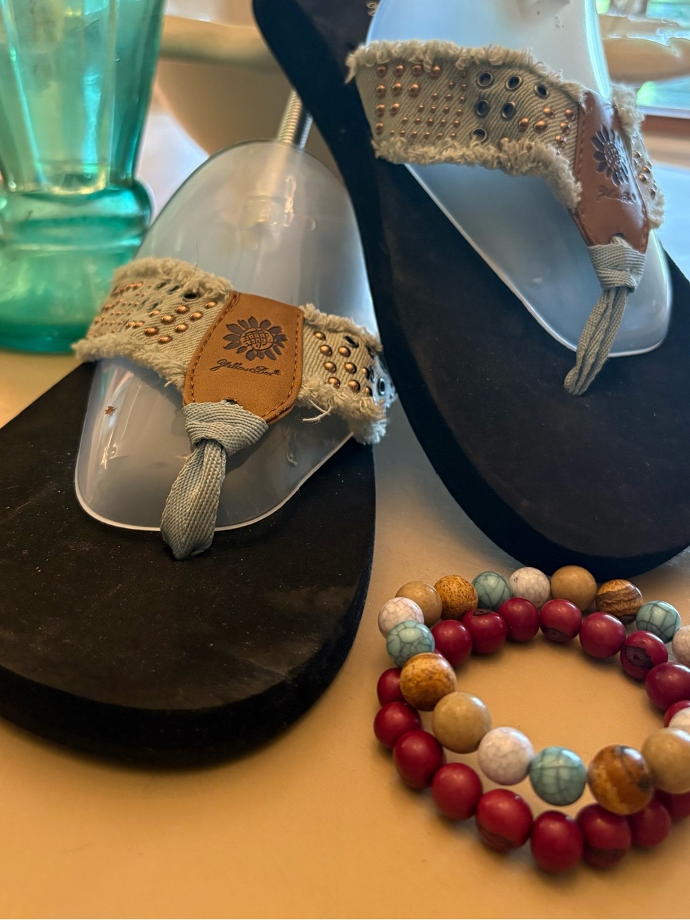Women’s Black Wedge Thong Sandals with Beige Frayed Straps.  Yellow Box